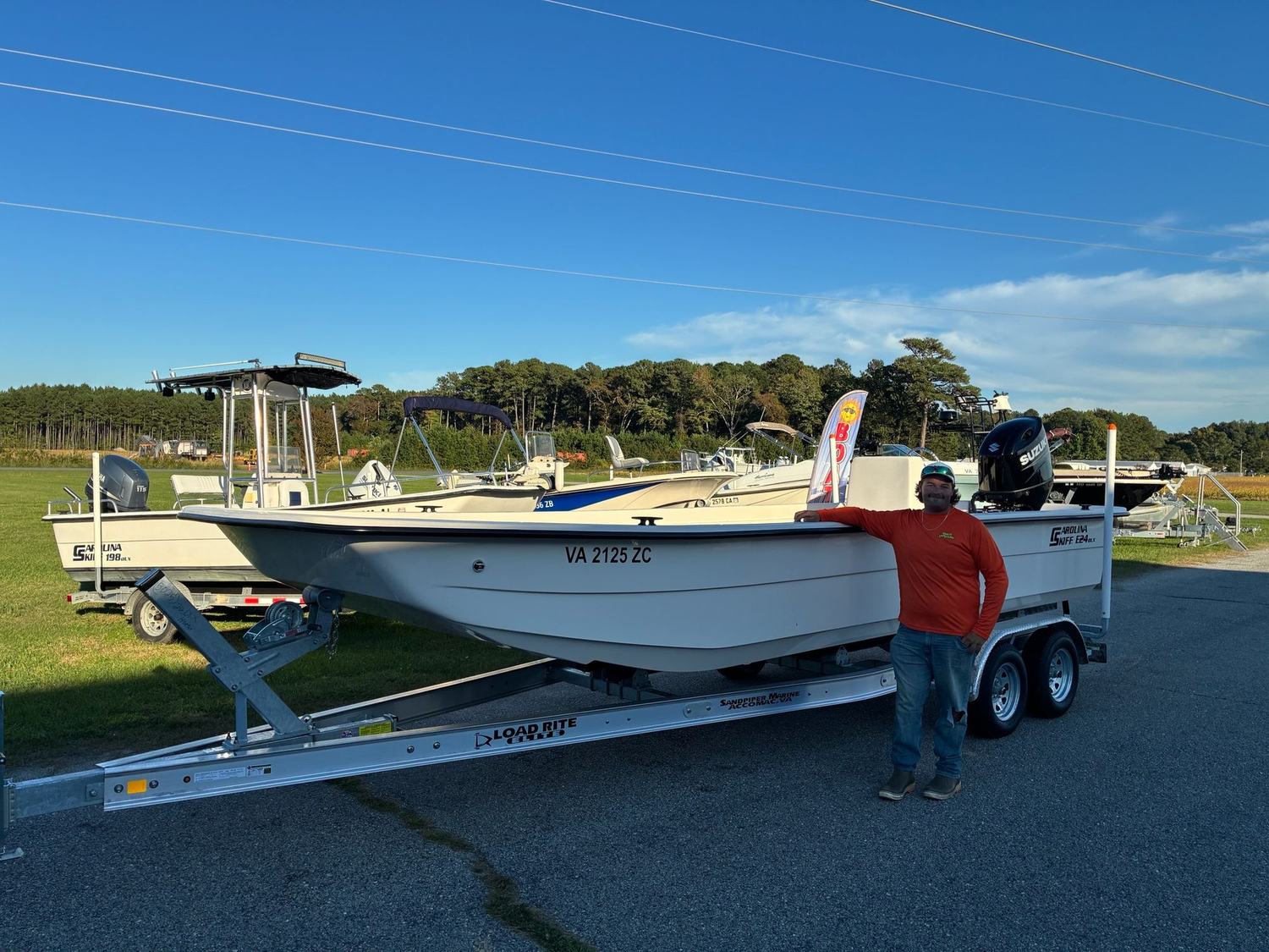 The outfit's Carolina Skiff E24 DLX on its trailer